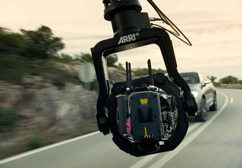 ARRI SRH-3 on a car arm following a car on a coastal road