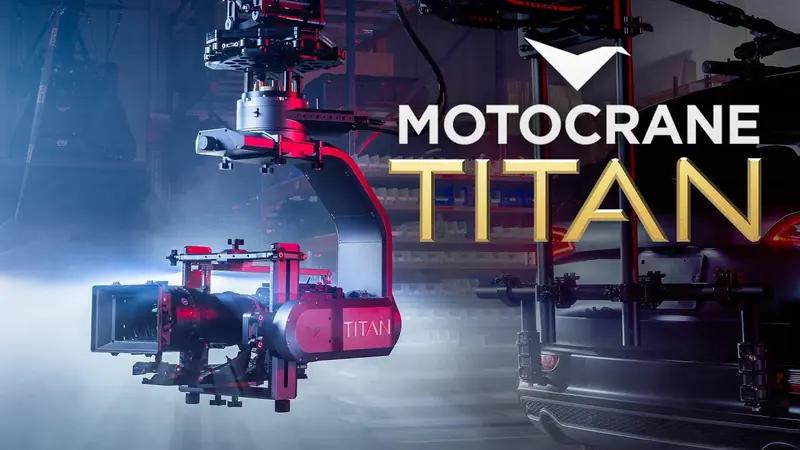 MotoCrane TITAN stabilized head with a cinema camera in a smoky studio, with the MotoCrane TITAN logo