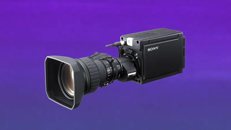 Sony HDC-P50 compact 4K POV camera with a broadcast zoom lens on a violet backdrop